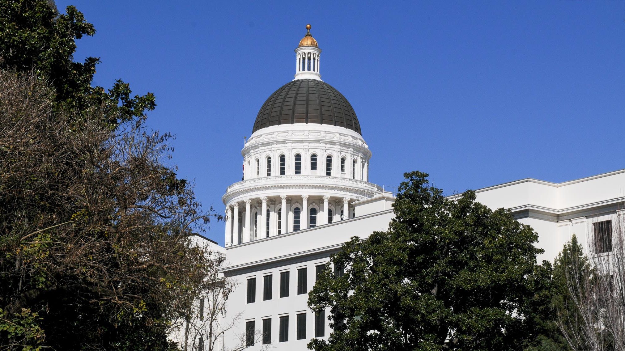 California State Capitol dome shines against blue sky