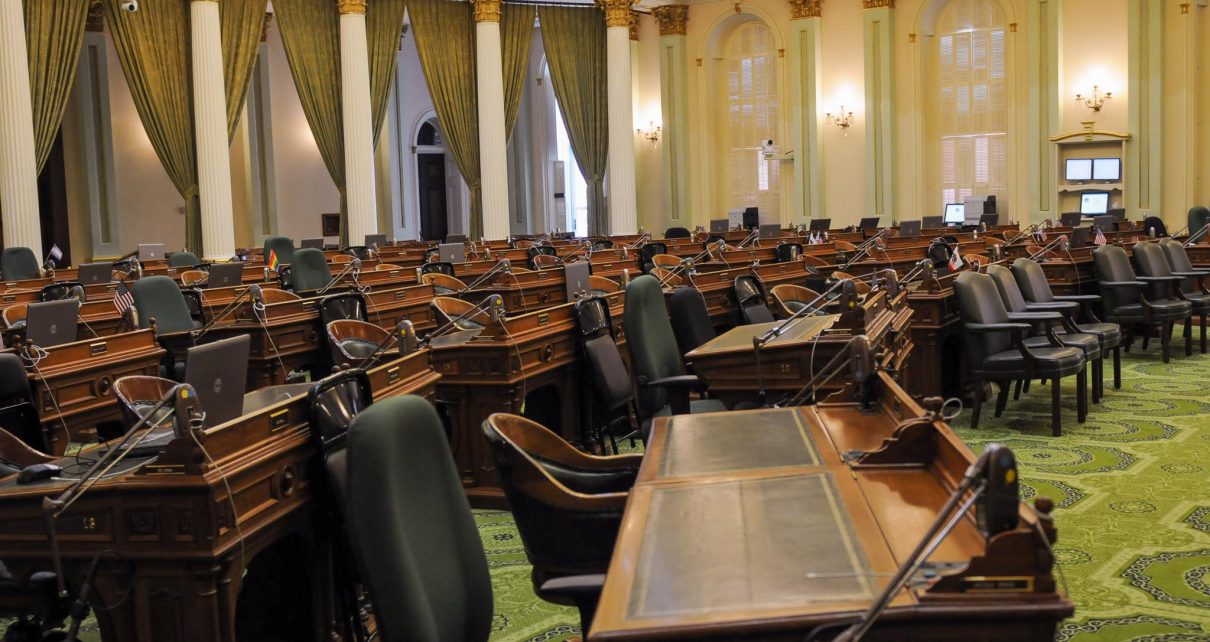 A sea of empty desks inside the California State Assembly