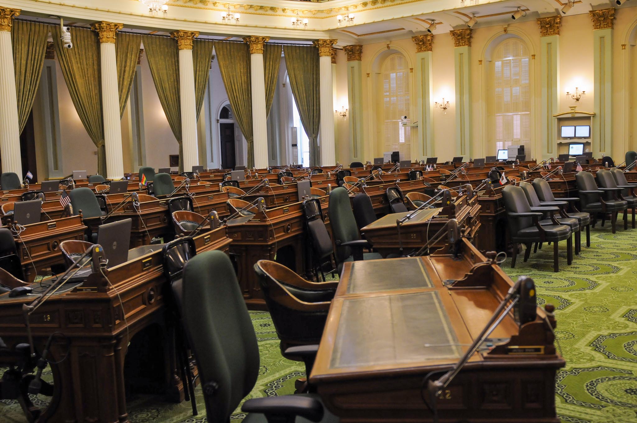 A sea of empty desks inside the California State Assembly